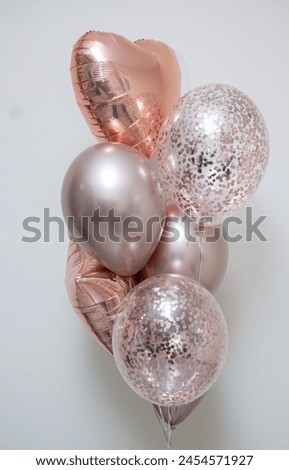 set of pink helium balloons on white background, inscription: "Happy Birthday"