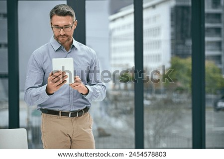 Digital tablet, online and businessman in office for schedule, planning agenda or checking email. Internet, technology and mature male person for networking, project management or professional Royalty-Free Stock Photo #2454578803