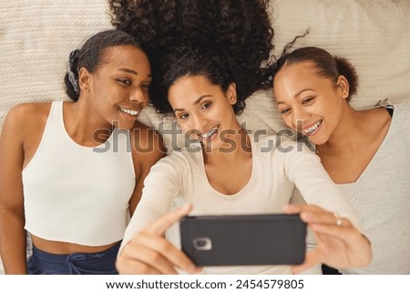 Women, selfie and friends smile in a home with profile picture, social media and happy at sleepover. House, bonding and online love in a bedroom with group, care and memories on bed with digital app