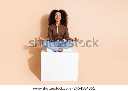 Full length photo of focused peaceful girl wear brown blouse meditating on platform close eyes isolated on pastel color background