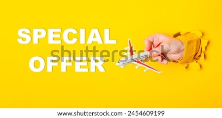 A hand holding a toy airplane with the words Special Offer written below it. The image has a playful and lighthearted mood, suggesting that the offer is for a fun or whimsical occasion