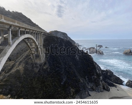 Bixby Creek Bridge and Pacific Ocean. Royalty-Free Stock Photo #2454611635