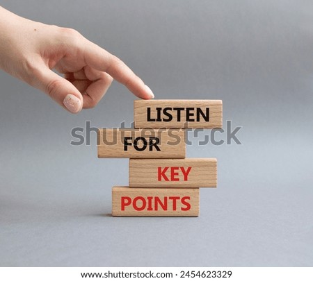 Key points symbol. Wooden blocks with words Listen for Key points. Businessman hand. Beautiful grey background. Business and Listen for Key points concept. Copy space.