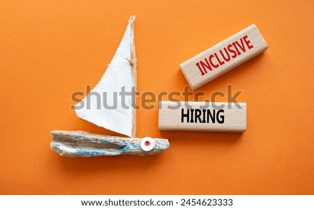Inclusive Hiring symbol. Wooden blocks with words Inclusive Hiring. Businessman hand. Beautiful orange background with boat. Business and Inclusive Hiring concept. Copy space.
