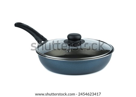 New skillet with plastic black handle and glass lid on a white background.
