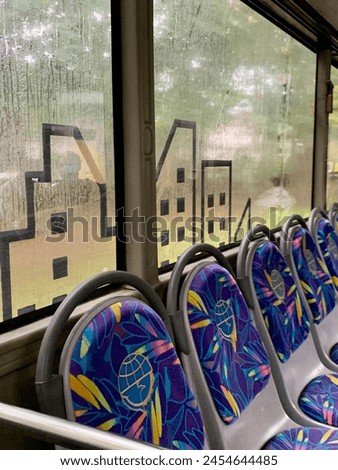 the atmosphere on the bus when it rains Royalty-Free Stock Photo #2454644485