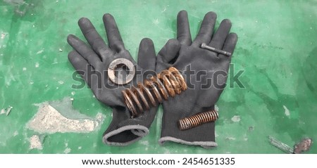 Industrial gloves work with broken machine springs.