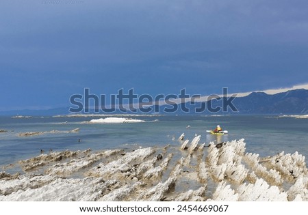 lonely canoeist in the beautiful sea Royalty-Free Stock Photo #2454669067