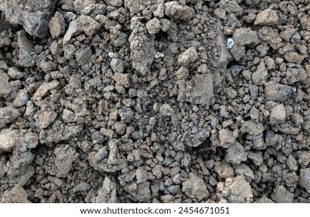 background and texture. Dry soil mixed with rocks and limestone in construction site.
 for building the house Industrial object photo, close-up and selective focus.