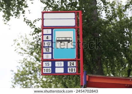 Bus stop background. Bus ticket prices rising. Cost of public transport. Red construction isolated on tree. Bus number information. Public park transportation. Various numbers of lines.