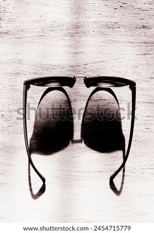 Eyeglasses with strong sunlight, high contrast, optical illusion, black and white style. Concepts and ideas