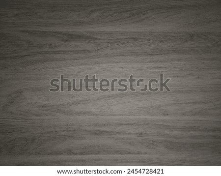 High-resolution image of a wooden surface with detailed wood grain patterns.