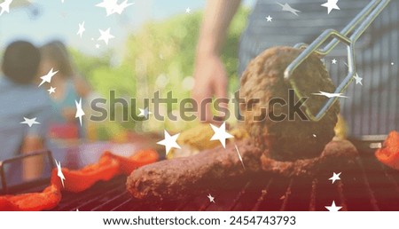 Image of stars over happy caucasian family talking and having bbq. bbq day and celebration concept digitally generated image.
