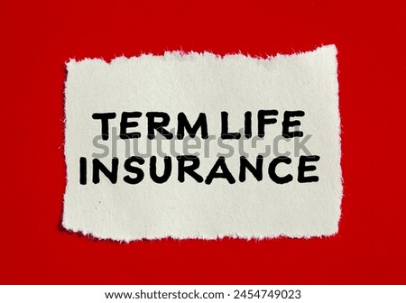 Term life insurance words written on ripped paper with red background. Conceptual term life insurance symbol. Copy space.