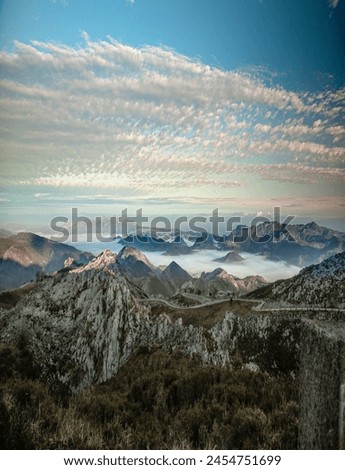 PANORAMIC VIEW OF THE SEA OF CLOUDS BETWEEN THE MOUNTAINS FROM THE TOP OF THE PEAKS OF EUROPE 