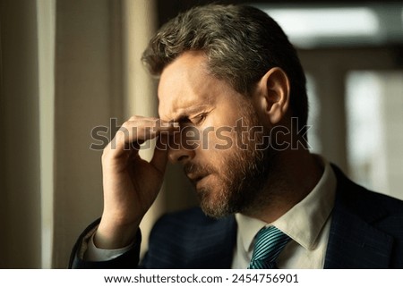 Head pain concept. Cephalalgia and migraine. Man with sinus headache, tension or cluster headache. Head pain, migraine symptoms. Chronic headaches. Headache triggers. Royalty-Free Stock Photo #2454756901