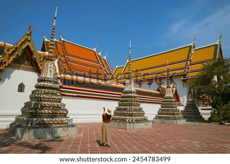 Female Visitor at The Temple of Reclining Buddha or Wat Pho, Located in Rattanakosin Island, Bangkok, Thailand