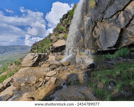 Waterfall rainbow sky and mountain best photo of the year