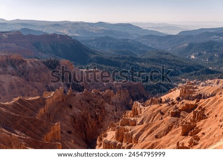 Cedar Breaks National Monument in Utah. A natural amphitheater filled with hoodoos, windows, canyons, spires, walls, and steep cliffs. A veiw from the canyon rim.  Royalty-Free Stock Photo #2454795999