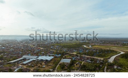 View from above of Sorong city with commercial airplanes flying, Southwest Papua Indonesia in Southeast Asia.