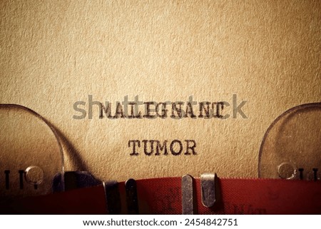 Malignant tumor text written with a typewriter. Royalty-Free Stock Photo #2454842751