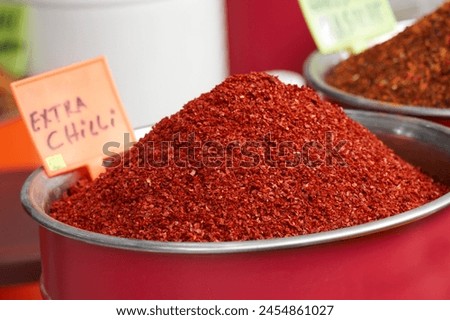 The photo features chili powder, dried chili, chili flakes, spices, seasoning, kitchen essentials, cooking spices, culinary spices, culinary herbs, spicy food, spicy seasoning, cooking ingredients