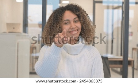 Portrait of African Woman Pointing at Camera