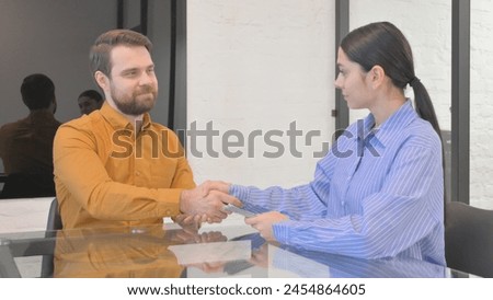 Woman Getting Paid Money in Office, Hand Shake