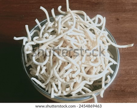 Ting ting snacks made from delicious rice flour are placed on the table Royalty-Free Stock Photo #2454869463