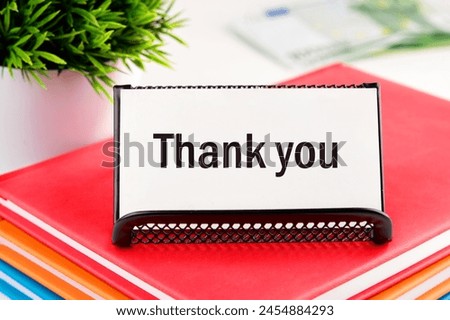 Text Thank You on white business cards in delivery on a light background