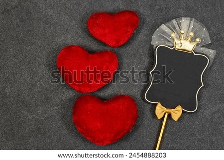 empty. acrylic topper card for wishes for birthday party with red heart cushion on grunge gray background