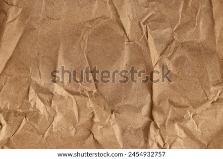 High-resolution image of a textured crumpled brown paper.