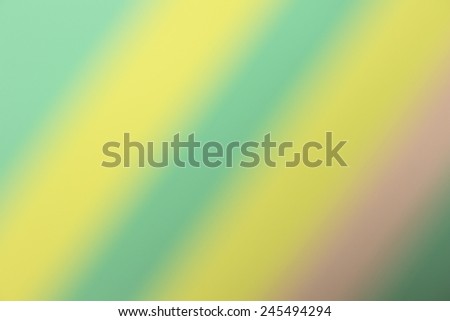 Blurry light background with colored paper.