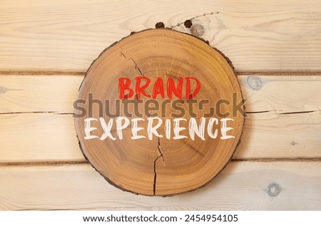Brand experience symbol. Concept words Brand experience on beautiful wooden circle. Beautiful wooden wall background. Business branding and brand experience concept. Copy space.
