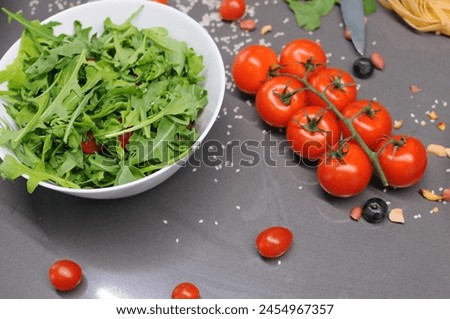 Fresh tomatoes in a plate on a dark background. Harvesting tomatoes. Top view. High quality photo