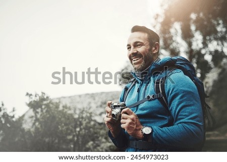 Backpack, man and camera for travel for outdoor photography with a smile from adventure. Exercise, journey and happy traveler with hiking and landscape photographer on a eco friendly vacation