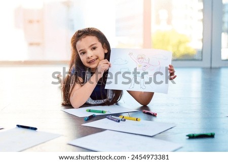 Female child, picture and drawing on floor in house with color pencil for development. Girl, playing and learning in home with portrait by paper for kindergarten, homework and homeschool education