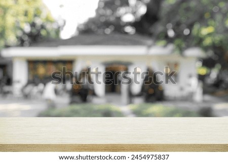Empty wooden table with blurred background of cafe or Christmas house. 