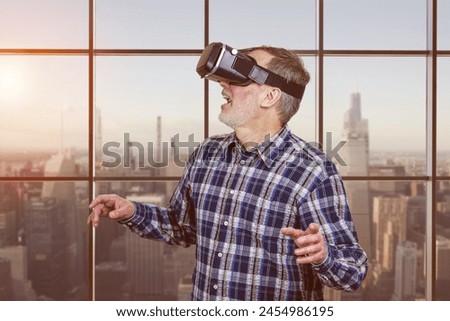 Portrait of excited elder man in vr headset. Checkered window background.