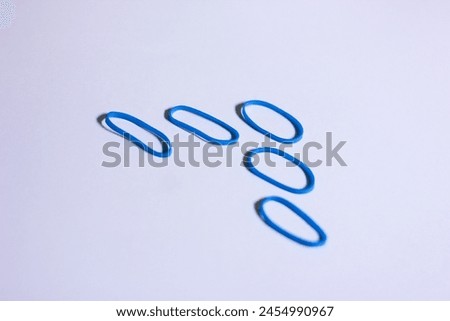 conceptual photo of blue vibrant mini rubber arranged in up arrow shape look alike, increment or improvement process illustration Royalty-Free Stock Photo #2454990967