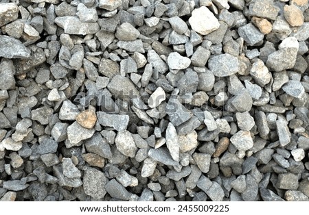 Macro view of dark gray rocks,
 stone ,gravels texture background.in construction site.
Pile of  for building the house Industrial object photo