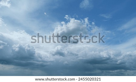 Heavy rain is coming. Cumulus dark clouds harbinger of bad weather and heavy rains. Timelapse. Royalty-Free Stock Photo #2455020321