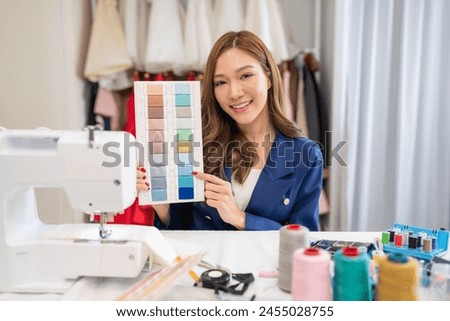 Portrait of young woman fashion designer stylish working in dressmaker studio or workshop, Fashion design concept.