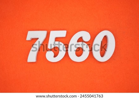 Orange felt is the background. The numbers 7560 are made from white painted wood.