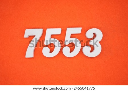 Orange felt is the background. The numbers 7553 are made from white painted wood.