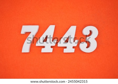 Orange felt is the background. The numbers 7443 are made from white painted wood.