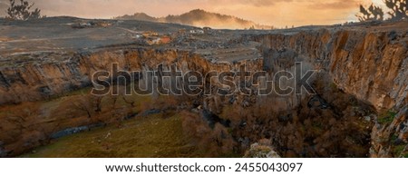 Famous and popular tourist attraction of Cappadocia and Turkey is the Ihlara Valley with a deep gorge and steep cliffs with hiking paths Royalty-Free Stock Photo #2455043097