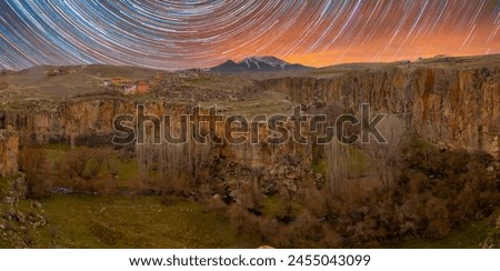 Famous and popular tourist attraction of Cappadocia and Turkey is the Ihlara Valley with a deep gorge and steep cliffs with hiking paths Royalty-Free Stock Photo #2455043099