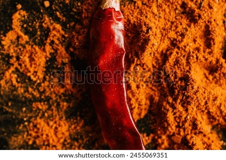 This captivating photo showcases a vibrant array of culinary essentials, including chili powder, dried chili, chili flakes, spices, seasoning, and culinary herbs. From the aromatic spice blend to the 