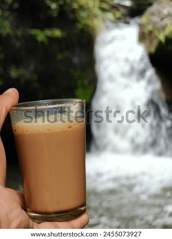 Strong Tea with waterfall background 